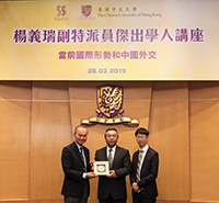 Pro-Vice-Chancellor Fok Tai-fai (left) and Prof. Anthony Fung (right) present souvenir to Deputy Commissioner Yang Yirui